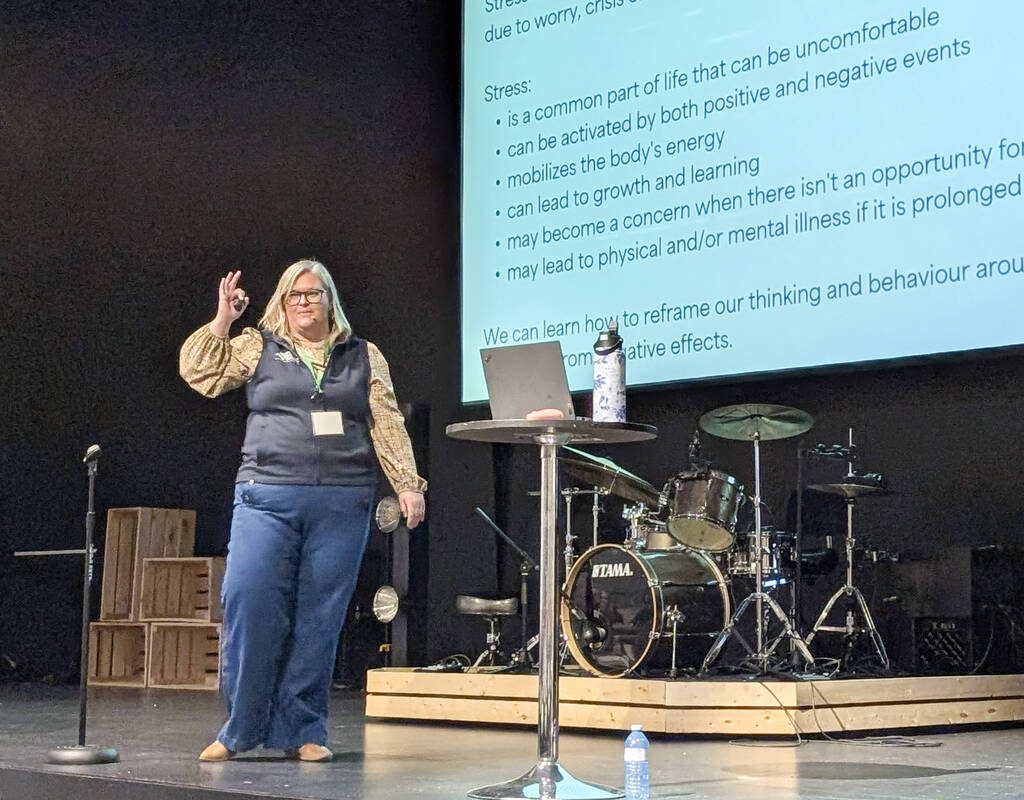 Megan Burnside-Poitras of Agricultural Wellness Ontario speaks on stage at the Eastern Ontario Crops Conference Jan. 27. Photo: Jonah Grignon