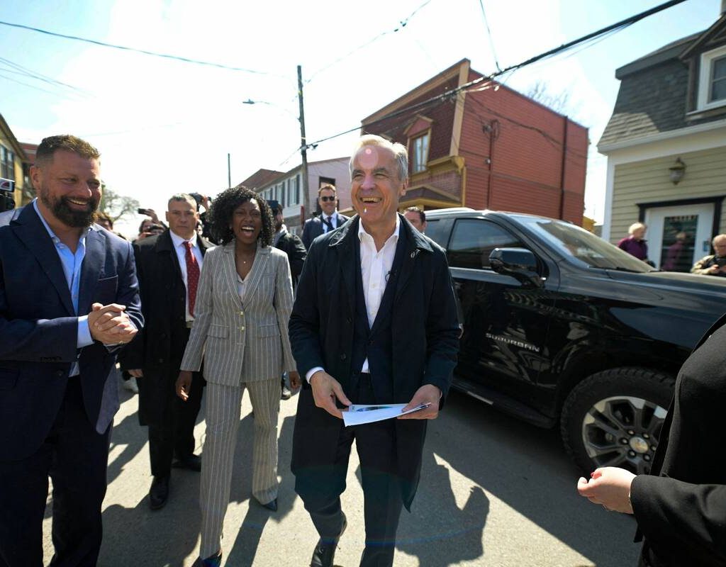 Prime Minister Mark Carney visits a local store with Liberal Party candidate Tatiana Auguste, ahead of the by-election in Terrebonne, Quebec, Canada April 9, 2026. Photo: REUTERS/Peter McCabe