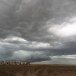 Old granaries standing in a stubble field with an ominous sky of grey clouds. This week’s Prairie forecast shows several storm systems are setting up across the Prairies with potential for rain, freezing rain and snow.