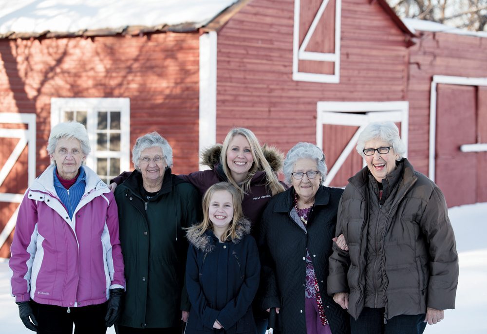C.C. and Anna’s descendants still regularly gather at Evergreen Farm. From left to right are sisters Eleanor Dueck, Erma Klassen, great-granddaughter Ashlyn Meek, granddaughter Blayne Meek, and sisters Gladys Isaac and Ruth Ratzlaff.