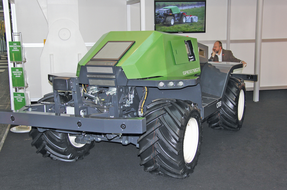 The tractor has both front and rear three-point hitches and PTO.
