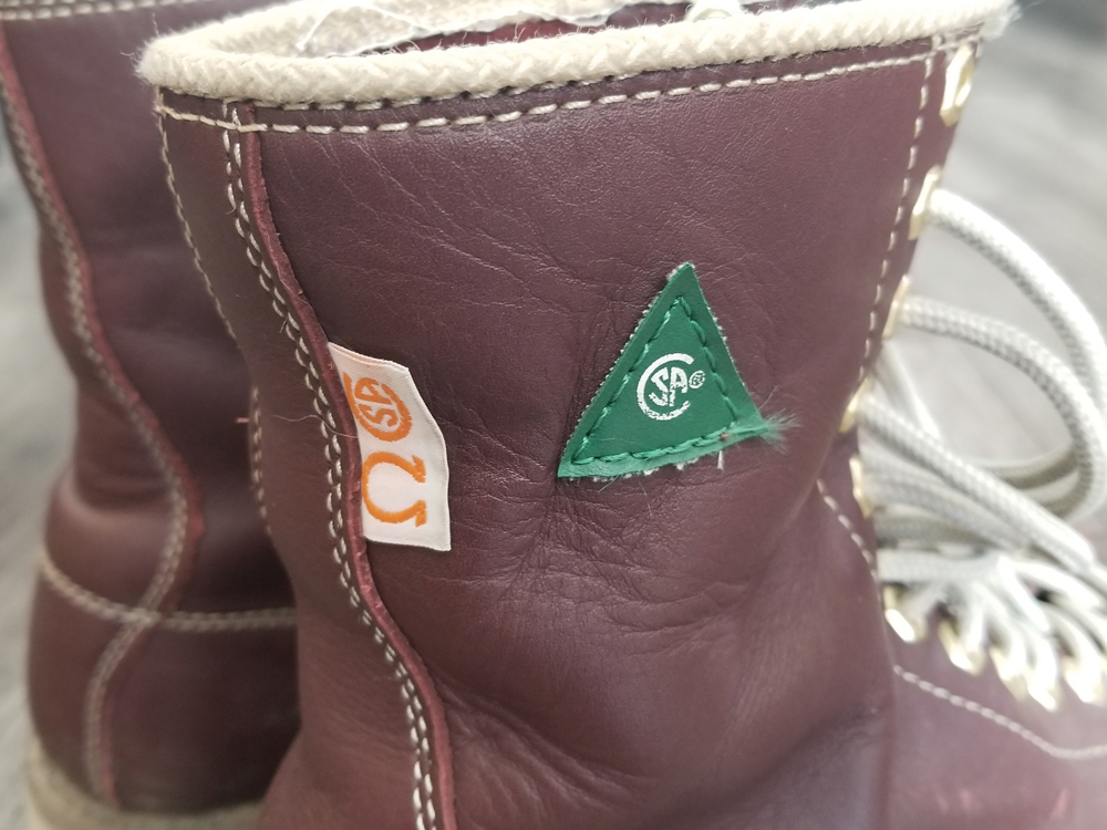 safety shoes with green triangle
