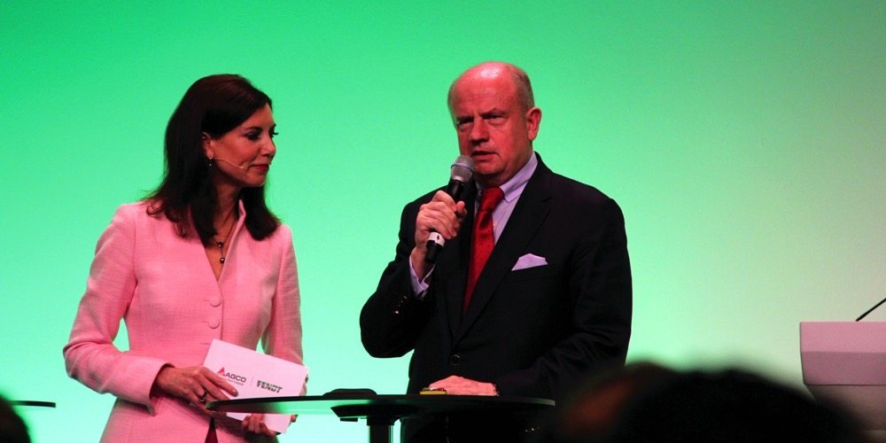 Martin Richenhagen and a German emcee shared the stage during an AGCO press conference in Hanover, Germany, in November.